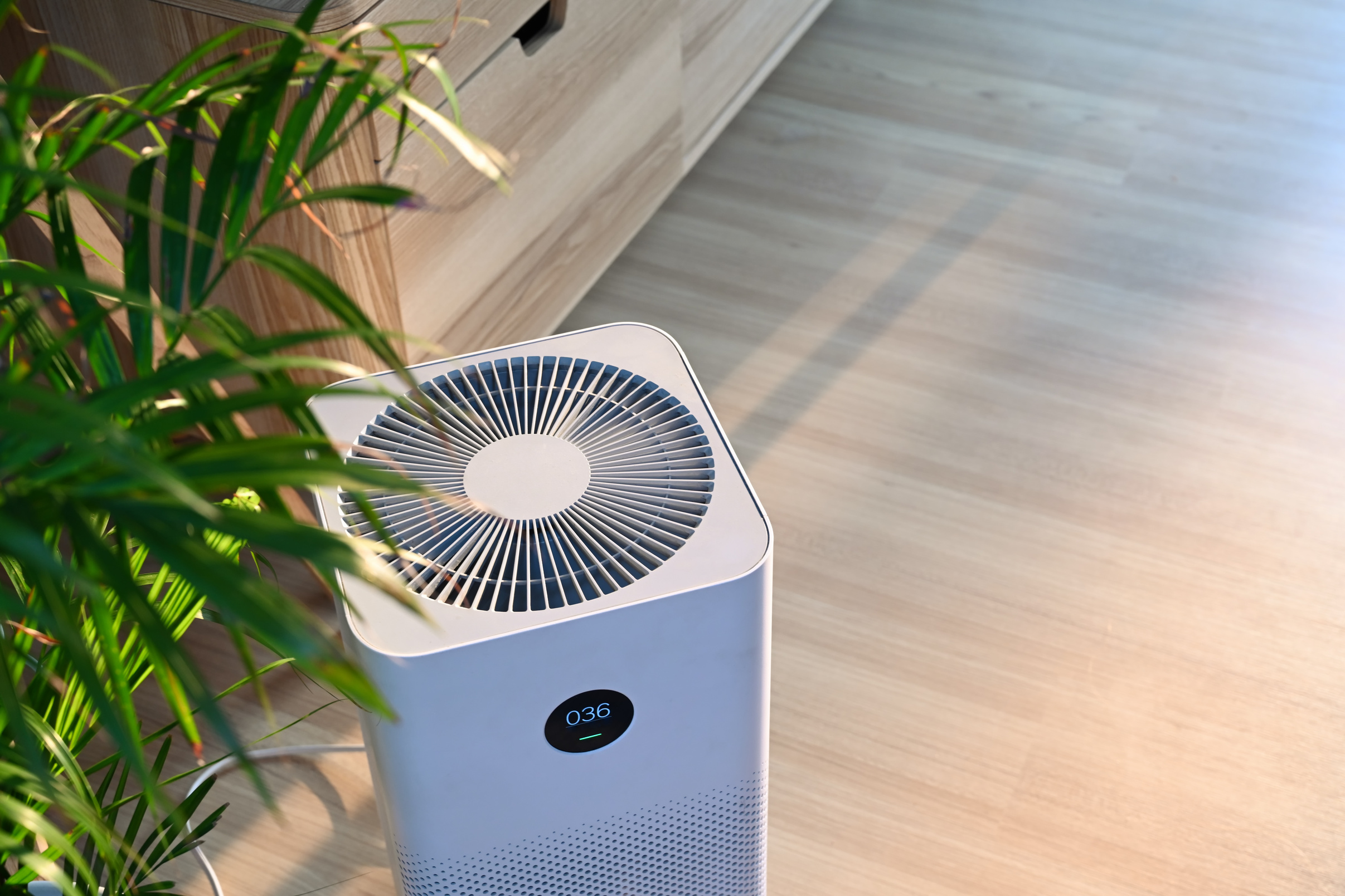 Air Purifier on Wooden Floor in Comfortable Home. Fresh Air and